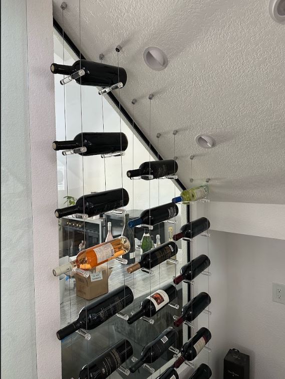 Elevate your wine display with our cable and acrylic wine racks. Create ...